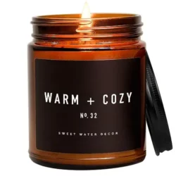 Cozy soy candle: Pine, orange, cinnamon & fir balsam scents. 9oz amber jar, 40-hour burn. Made in the USA.